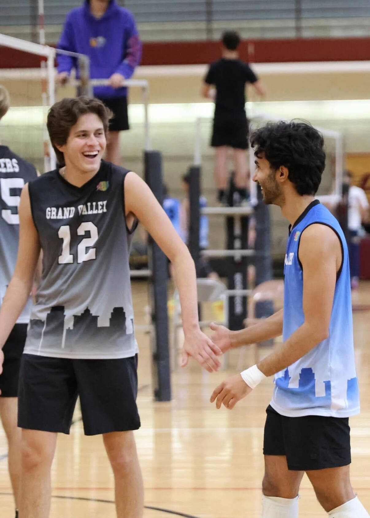 Two A team players smiling after a well deserved point!